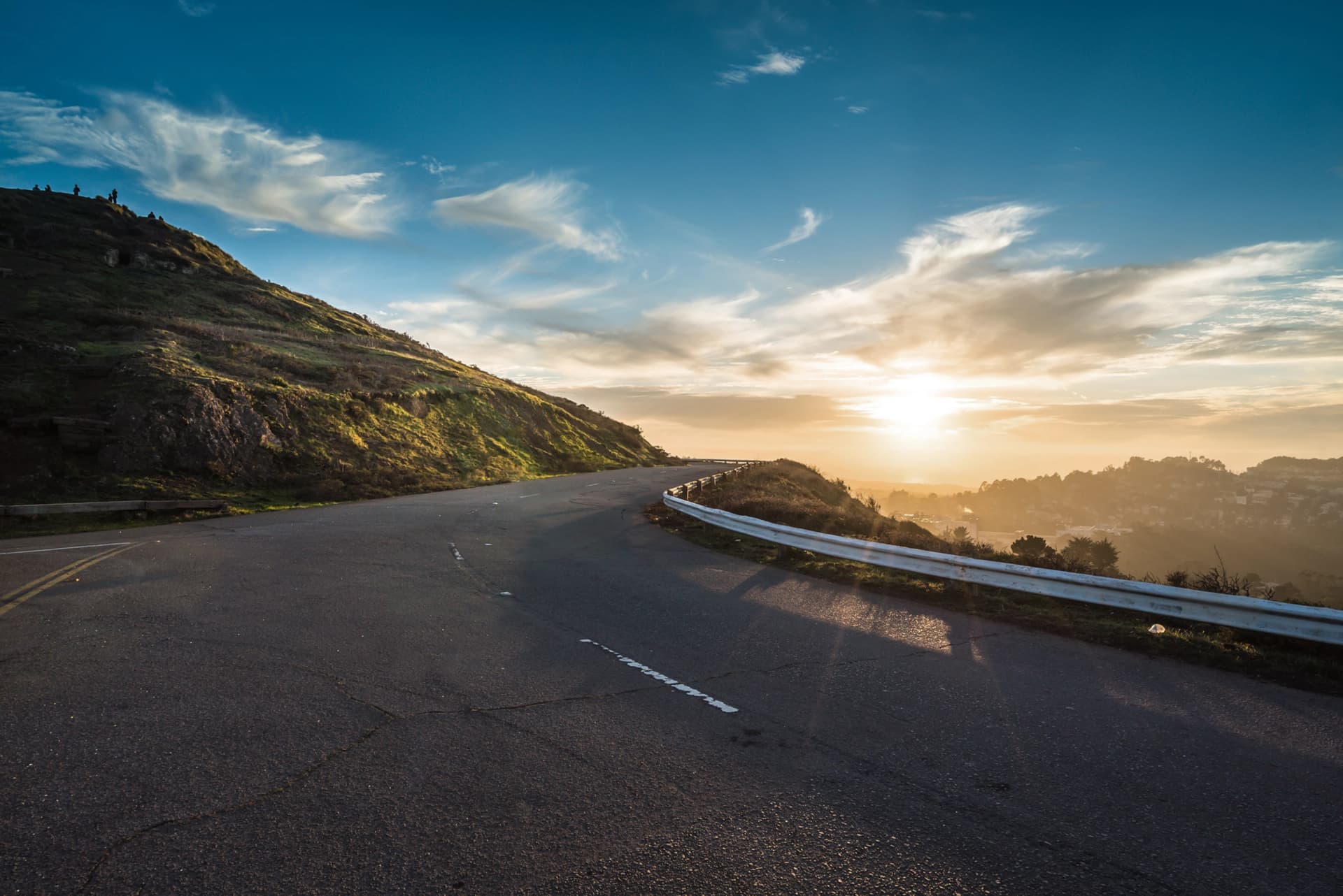 Road curving toward sunrise