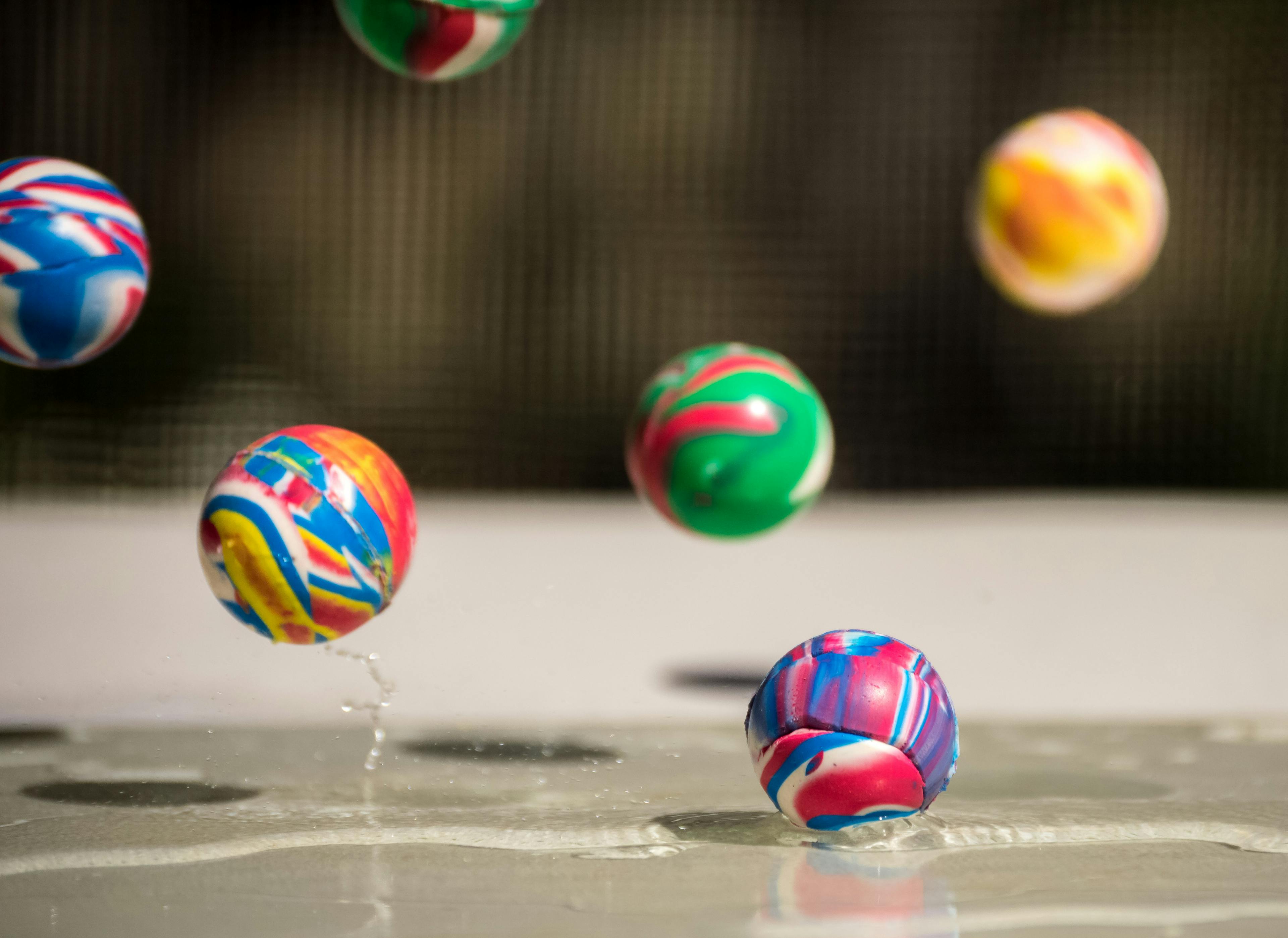 Balls bouncing on a wet surface